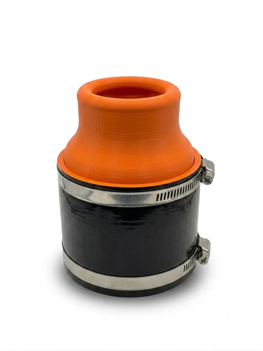 An orange stepped adapter cone fitted into a black silicone sleeve with two hose clamps