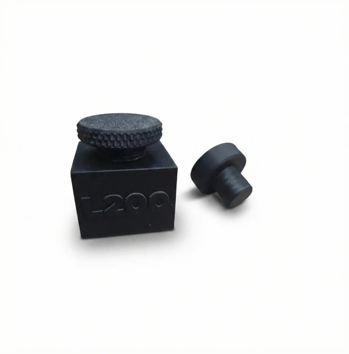 A black printed AdBlue blanking block marked L200, with its plug