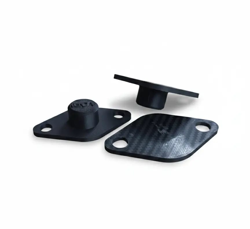 Two black printed blanking plates for the EGR opening on Renault and Nissan filters
