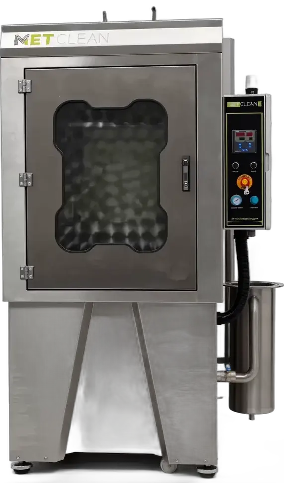 METClean E from the front, showing the door with viewing window, the control panel and the filter housing